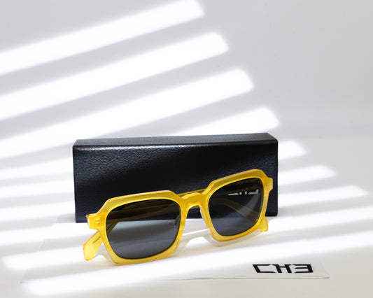 Espejuloes Gafas de sol acetato japonés amarillas transparente sobre mesa con sombras